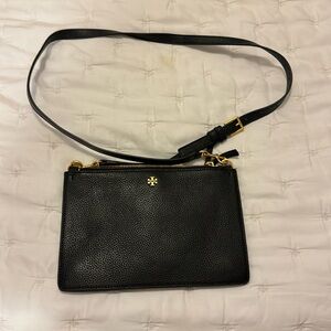 Tory Burch black crossbody, adjustable strap. 3 pockets, 2 zip, 1 magnetic.